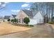 A nice angle of the house featuring a two-car garage with a concrete driveway at 3130 Goldmist Dr, Buford, GA 30519