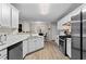 Modern kitchen featuring stainless steel appliances, and ample cabinet space at 3130 Goldmist Dr, Buford, GA 30519
