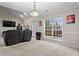 Bright living room with large windows, comfortable seating, and stylish decor at 3130 Goldmist Dr, Buford, GA 30519