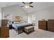 Main bedroom with a vaulted ceiling, carpet floor, and an ensuite bathroom entrance at 3130 Goldmist Dr, Buford, GA 30519