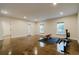 Spacious basement gym featuring a large open area, sleek flooring, and an array of exercise equipment at 4022 Newhaven Cir, Brookhaven, GA 30319