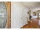 Inviting foyer featuring hardwood floors and a view into the living room with a fireplace at 8620 Hope Mews Ct, Sandy Springs, GA 30350