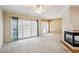 Spacious living room with a fireplace and sliding glass doors to the backyard at 8620 Hope Mews Ct, Sandy Springs, GA 30350