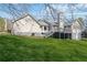 Expansive backyard featuring a well-maintained lawn, stone foundation and an elevated deck at 250 Felton Dr, Fayetteville, GA 30214