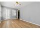 Cozy bedroom with neutral paint, wood-look floors, and a ceiling fan at 250 Felton Dr, Fayetteville, GA 30214