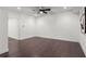 Open basement area with hardwood floors, recessed lighting, and ceiling fan at 261 Thompson St, Alpharetta, GA 30009