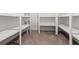 Cozy basement area with carpet and built-in shelving at 261 Thompson St, Alpharetta, GA 30009