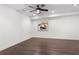 Spacious basement with hardwood floors, white walls, recessed lighting, and ceiling fan at 261 Thompson St, Alpharetta, GA 30009