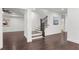 Large basement with hardwood floors, white trim and walls, and a staircase at 261 Thompson St, Alpharetta, GA 30009