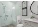 Bathroom featuring a glass shower door, quartz counters, tile, and modern fixtures at 261 Thompson St, Alpharetta, GA 30009