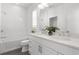 Bright bathroom featuring double sinks, quartz counters, tiled shower and soaking tub at 261 Thompson St, Alpharetta, GA 30009