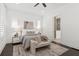 Bright bedroom showcasing neutral décor, dark floors, and an en-suite bathroom at 261 Thompson St, Alpharetta, GA 30009