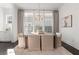 Elegant dining room with modern chandelier and natural light at 261 Thompson St, Alpharetta, GA 30009