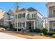 Charming two-story home with manicured lawn and inviting curb appeal on a bright day at 261 Thompson St, Alpharetta, GA 30009