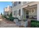 Inviting front porch with seating, decorative wreath, and professionally landscaped garden beds at 261 Thompson St, Alpharetta, GA 30009