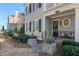 Inviting front porch with seating area, stone walkway, and beautiful landscaping at 261 Thompson St, Alpharetta, GA 30009