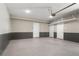 Spacious garage features neutral paint, beadboard paneling, and epoxy floors at 261 Thompson St, Alpharetta, GA 30009