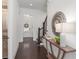 Inviting hallway with hardwood floors, staircase, and stylish console table at 261 Thompson St, Alpharetta, GA 30009