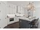 Modern kitchen with marble countertops, stainless steel appliances and large island at 261 Thompson St, Alpharetta, GA 30009