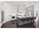 The gourmet kitchen features an island and stainless steel appliances at 261 Thompson St, Alpharetta, GA 30009