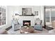 Bright living room featuring a brick fireplace and comfortable seating arrangement at 261 Thompson St, Alpharetta, GA 30009