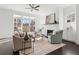 Inviting living room with white brick fireplace and light-filled windows at 261 Thompson St, Alpharetta, GA 30009