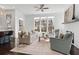 Spacious living room with hardwood floors, fireplace, and ample natural light at 261 Thompson St, Alpharetta, GA 30009