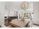 Open concept features a kitchen island, dining area, and flows into the living room at 261 Thompson St, Alpharetta, GA 30009