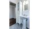 Bright bathroom featuring a pedestal sink, storage cabinet, and modern fixtures at 3125 Wilson Rd, Decatur, GA 30033