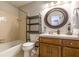 Cozy bathroom with tiled walls and a wooden vanity at 4210 Gladney Dr, Atlanta, GA 30340