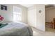 Neutral bedroom featuring a comfortable bed, carpet flooring and a closet for storage at 4210 Gladney Dr, Atlanta, GA 30340