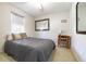 Neutral bedroom with a comfortable bed, carpet flooring, natural light and simple decor at 4210 Gladney Dr, Atlanta, GA 30340