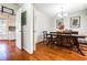 Traditional dining room with hardwood floors and elegant decor, adjacent to the kitchen at 4210 Gladney Dr, Atlanta, GA 30340