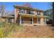 Exterior front elevation of a two-story brick home with a covered porch at 4210 Gladney Dr, Atlanta, GA 30340
