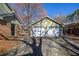 View of a two-car garage with white doors, attached to the house via a connecting breezeway at 4210 Gladney Dr, Atlanta, GA 30340