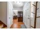 Hallway featuring hardwood floors and access to the dining room at 4210 Gladney Dr, Atlanta, GA 30340