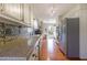 Bright kitchen featuring granite countertops, a stainless steel refrigerator, and hardwood floors at 4210 Gladney Dr, Atlanta, GA 30340