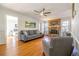 Cozy living room featuring a brick fireplace, hardwood floors, and comfortable seating at 4210 Gladney Dr, Atlanta, GA 30340