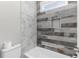 Bathroom with a shower with a built-in niche and tiled walls at 1200 Primrose Park Rd, Sugar Hill, GA 30518