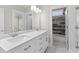 Bathroom features a double vanity with marble tile in shower at 1200 Primrose Park Rd, Sugar Hill, GA 30518
