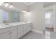 Stylish bathroom featuring double vanity, quartz countertops, and modern lighting at 1200 Primrose Park Rd, Sugar Hill, GA 30518