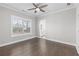 Bedroom with natural light, ceiling fan, and hardwood floors at 1200 Primrose Park Rd, Sugar Hill, GA 30518