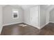 Bedroom with hardwood floors and large windows at 1200 Primrose Park Rd, Sugar Hill, GA 30518