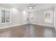 Spacious bedroom filled with lots of natural light and beautiful hardwood floors at 1200 Primrose Park Rd, Sugar Hill, GA 30518