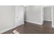 Bedroom with wood floors and access to an adjacent room at 1200 Primrose Park Rd, Sugar Hill, GA 30518