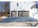 View of the garage with a large driveway at 1200 Primrose Park Rd, Sugar Hill, GA 30518