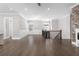 This open concept living space features hardwood floors, fireplace and staircase at 1200 Primrose Park Rd, Sugar Hill, GA 30518