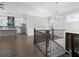 This open concept living space features hardwood floors and a modern kitchen at 1200 Primrose Park Rd, Sugar Hill, GA 30518