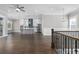 This open concept living space features hardwood floors and a modern kitchen at 1200 Primrose Park Rd, Sugar Hill, GA 30518