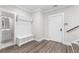 Stylish mudroom with coat rack, bench, and easy access to the bathroom at 1200 Primrose Park Rd, Sugar Hill, GA 30518